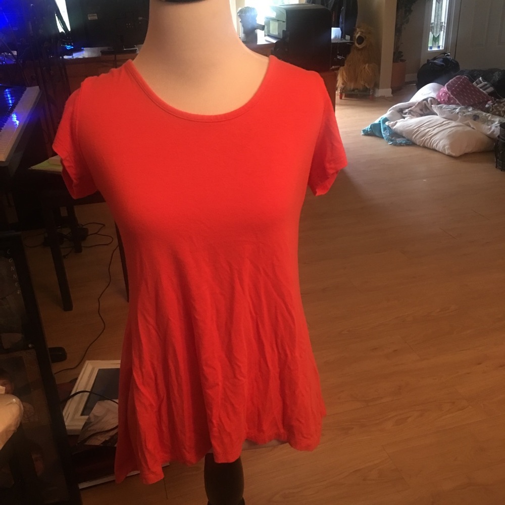 Salmon:pink colored tee shirt